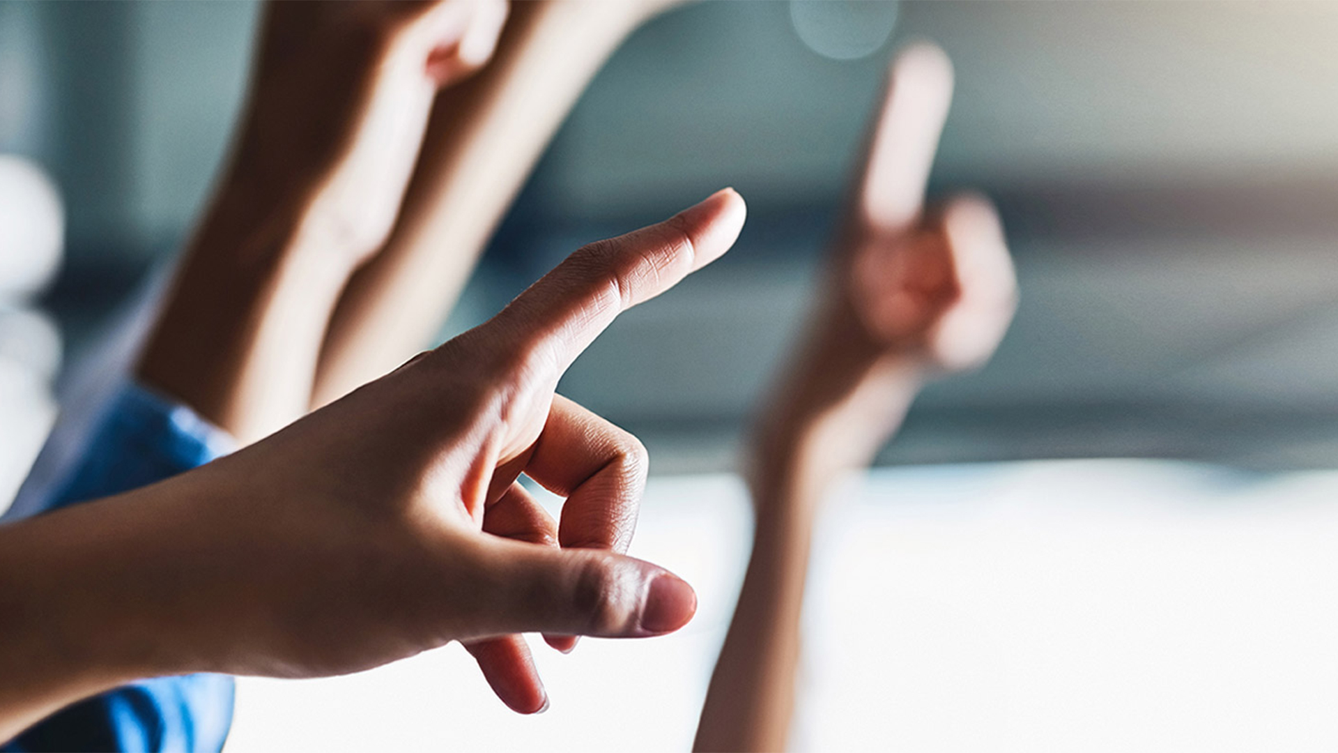 Hands raised to ask a question