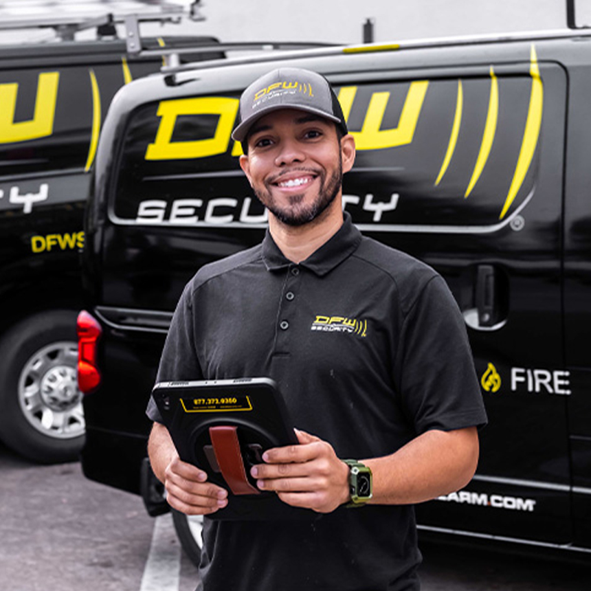 DFW Security installer in front  of company van