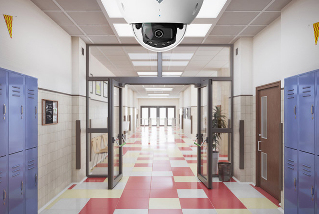 video cameras on the ceiling of a school hallway