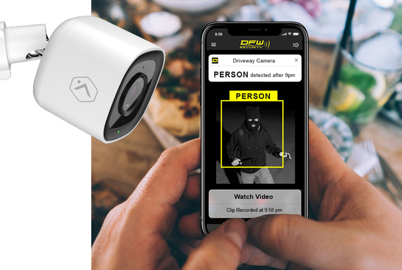 reading notification on phone that a person was detected in the driveway