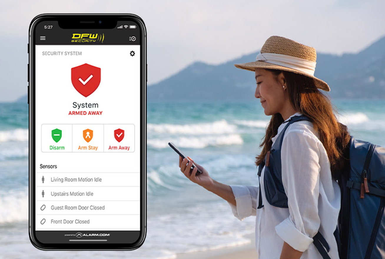 traveler checking her home security app from the beach