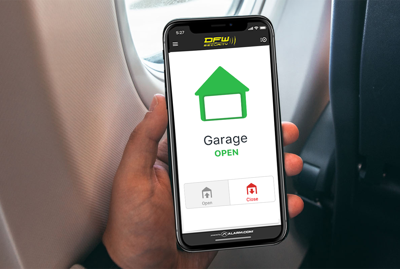 Man holding phone in an airplane controlling his garage door