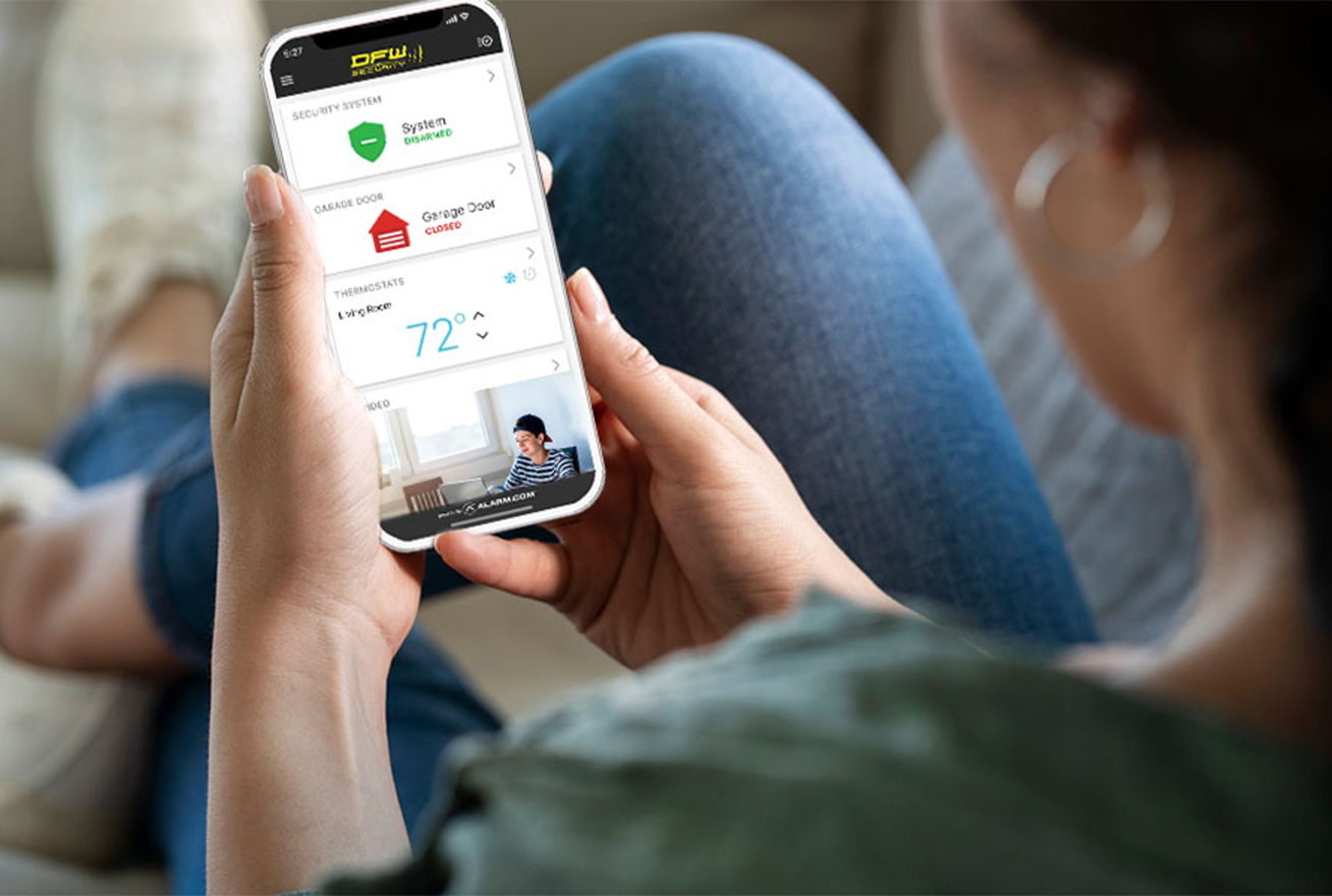 Woman looking at her phone with smart home automation app