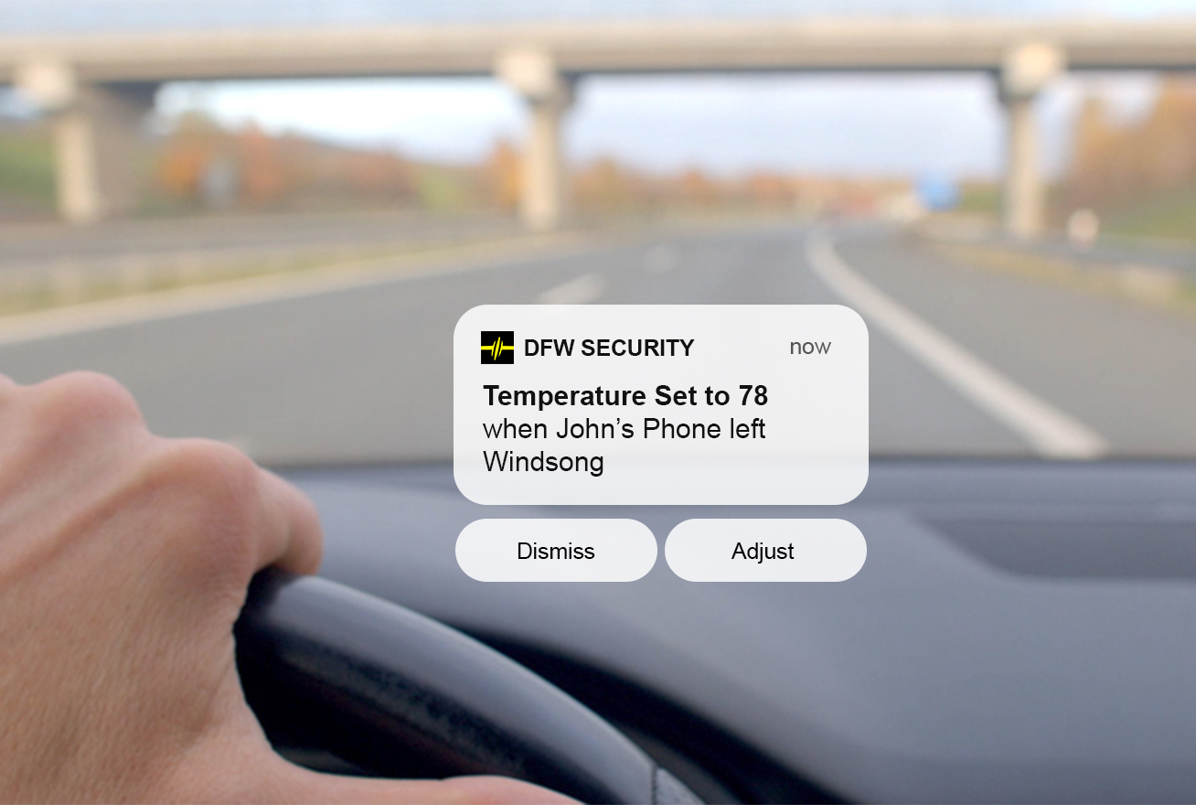 Person driving car with notfication that thermostat was adjusted when John left Windsong