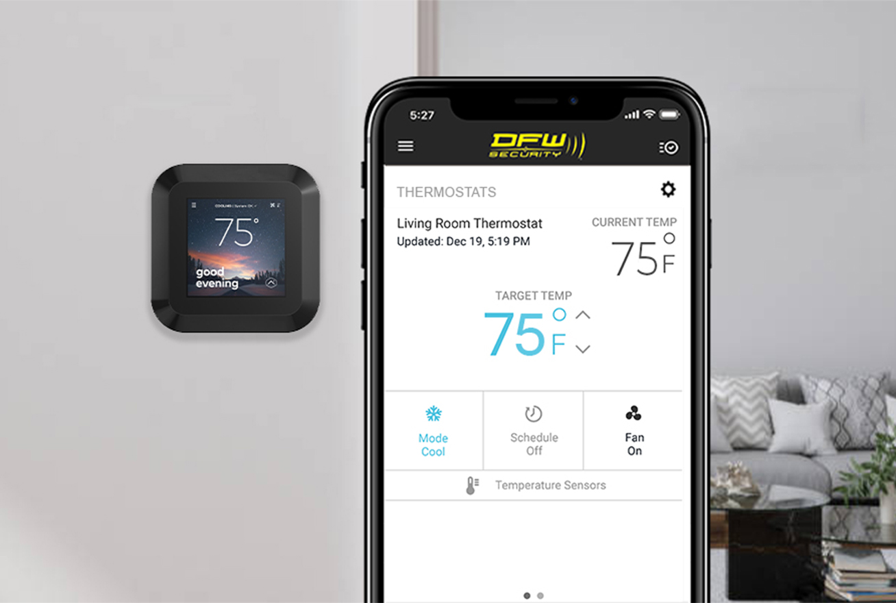 Smart home thermostat on wall next to app with controls