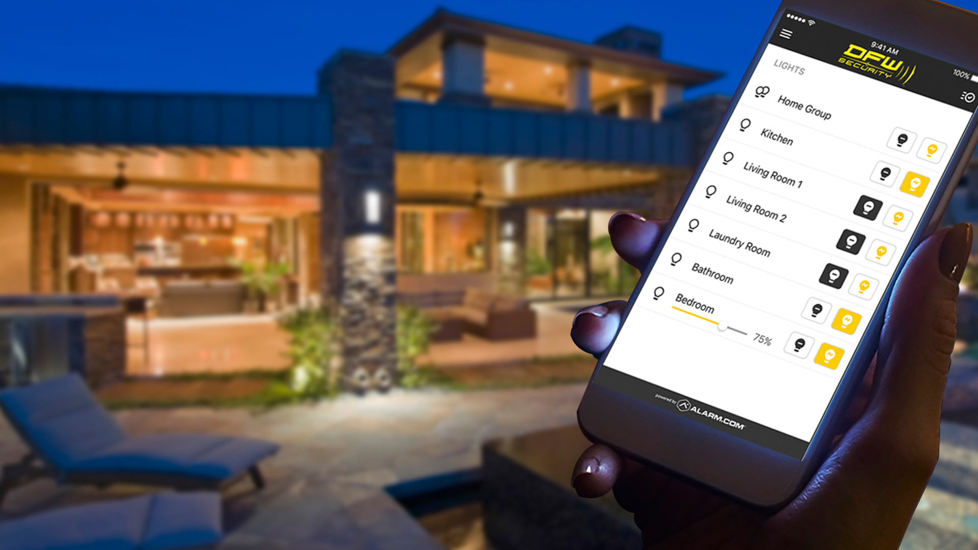 Hand holding phone with lighting control on screen and home in background
