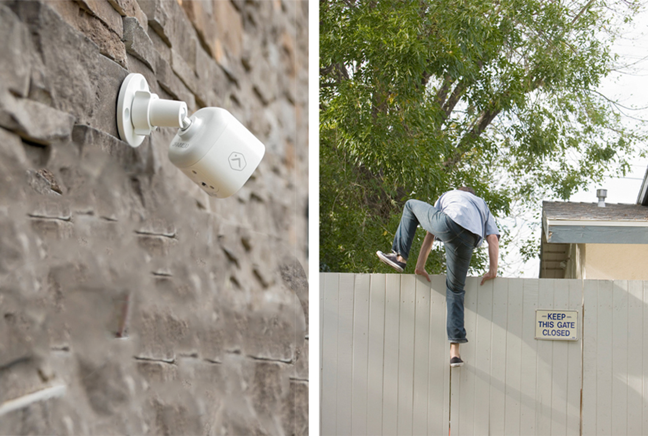 Camera on wall watching intruder climb over fence