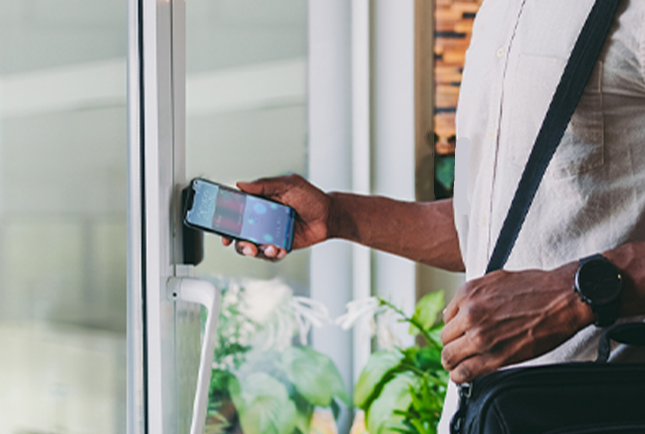 Man using phone for access control to his office