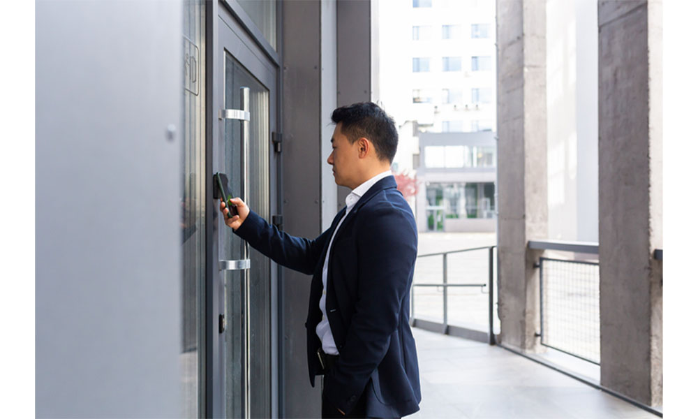 Man accessing door with smart phone