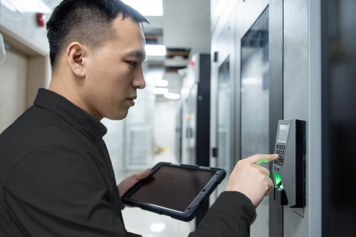 Technician installing access control system