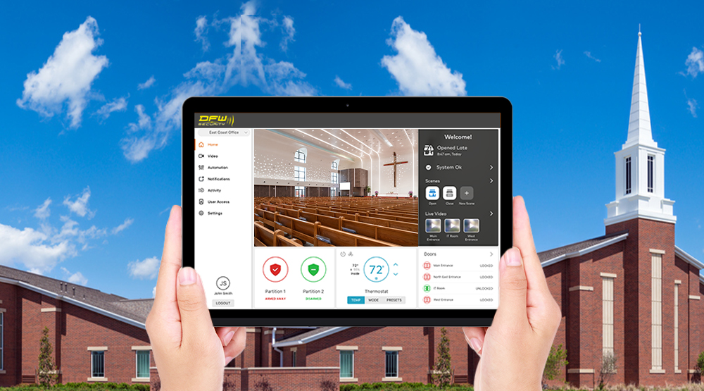 Person holdiing iPad viewing security of church building