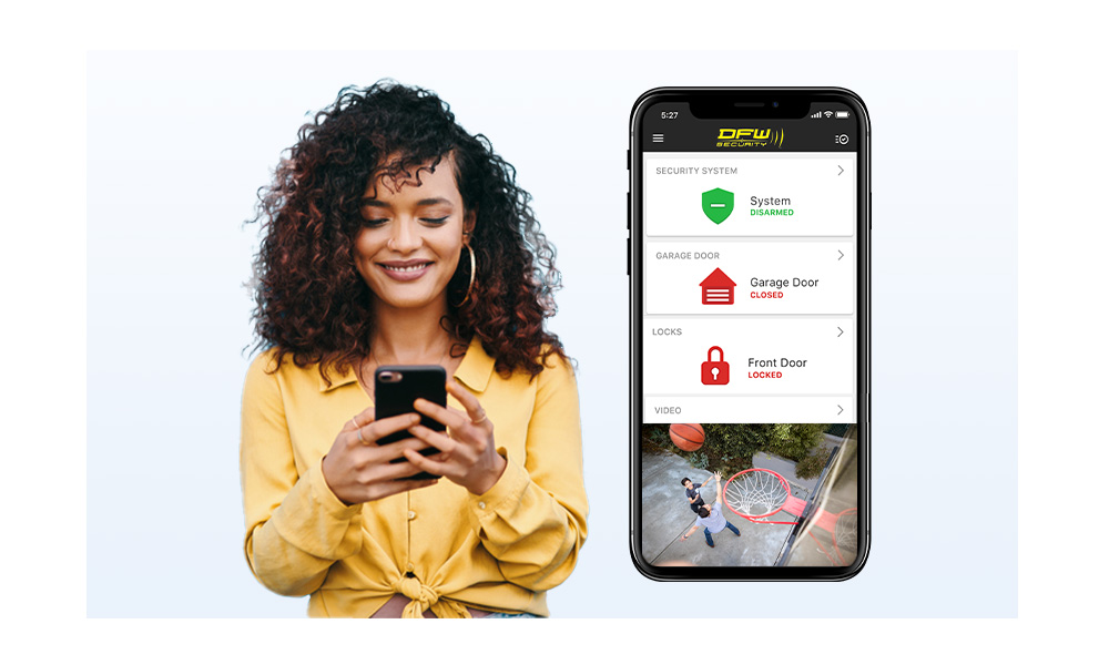 Woman checking her home security system on her smartphone