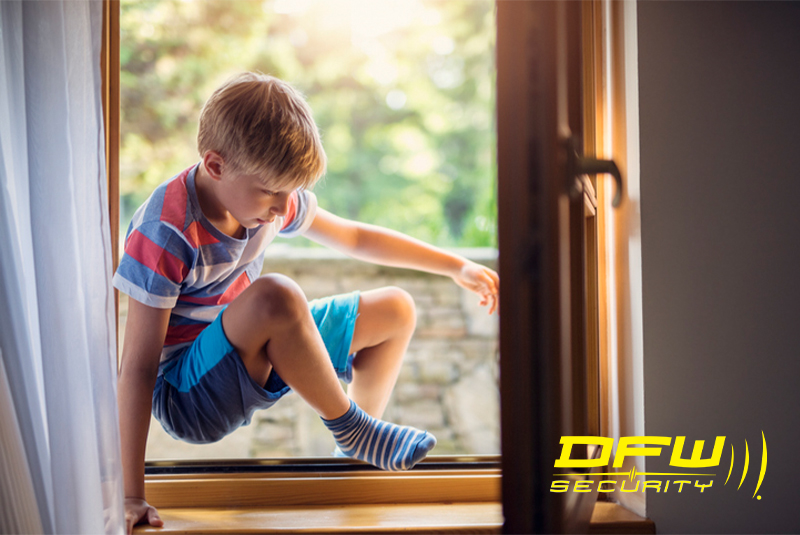boy climbing out of window