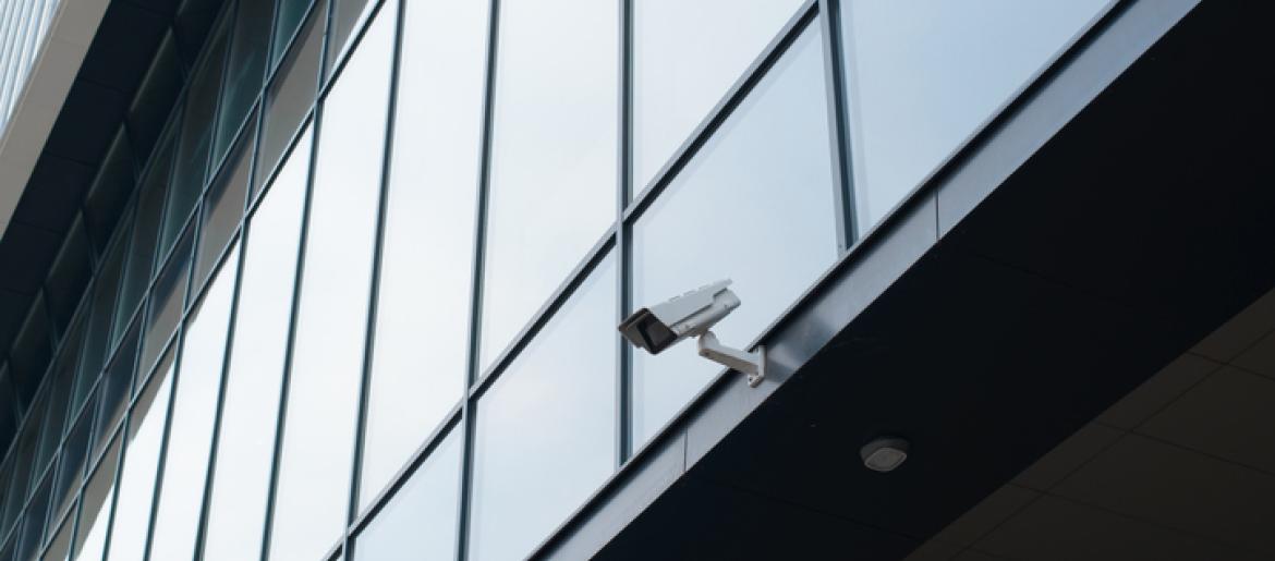 Exterior security camera on side of business building