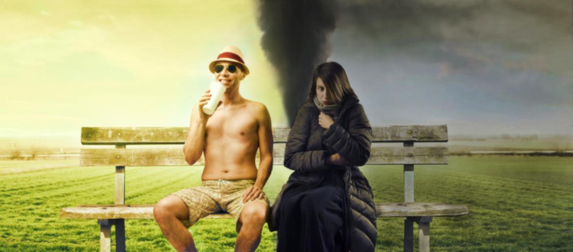 Man and woman sitting on bench, with different weather and clothing on each side of the bench