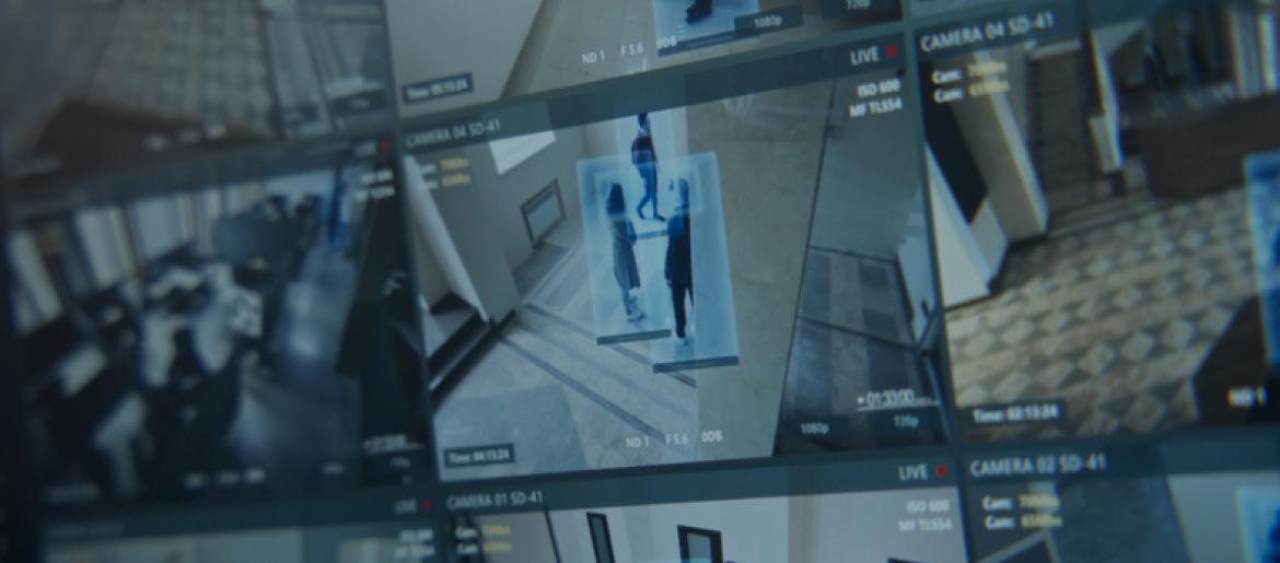 blurred image of security camera footage on screens