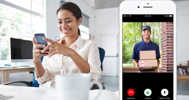 woman at work answering doorbell camera