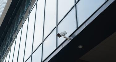 Exterior security camera on side of business building