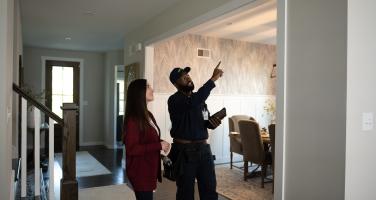 DFW Security Installer Showing Customer Her New Cameras