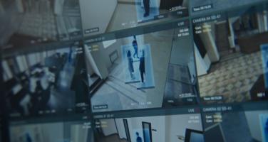blurred image of security camera footage on screens
